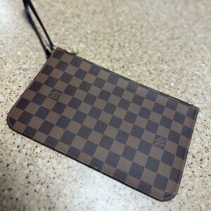 Authentic Louis Vuitton clutch. Brand new never used.
